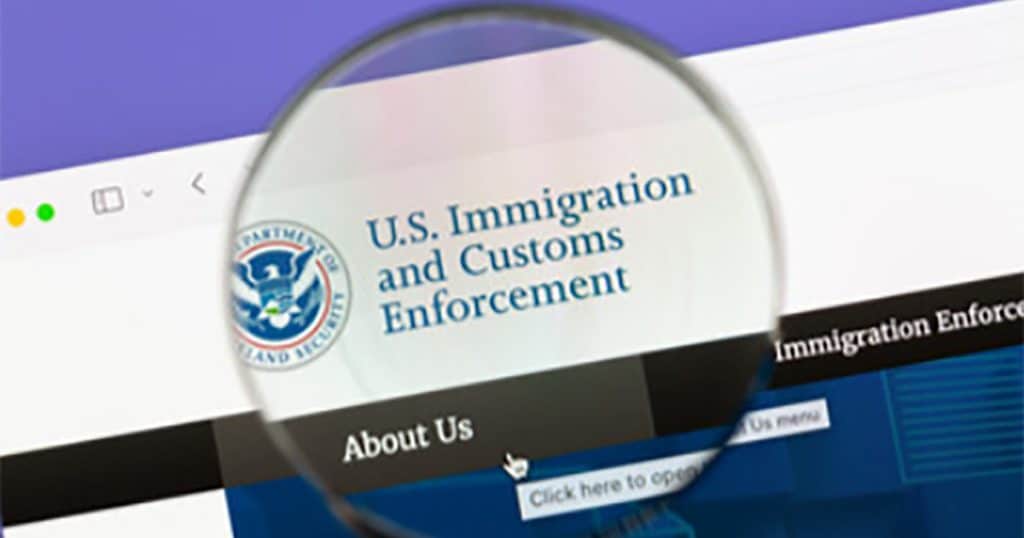 Magnifying glass looking at Immigration and Customs Enforcement logo